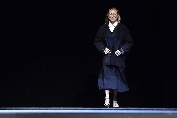 Miuccia Prada acknowledges the audience at the end of the Prada Autumn/Winter 2014 collection show during Milan Fashion Week February 20, 2014. REUTERS/Alessandro Bianchi (ITALY - Tags: FASHION) - RTX197LL