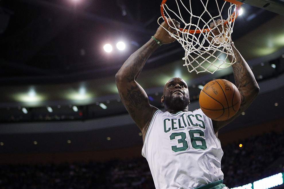 Boston Celtics center Shaquille O'Neal dunks the ball against the Detroit Pistons in the second quarter of their NBA basketball game in Boston, Massachusetts January 19, 2011. REUTERS/Brian Snyder (UNITED STATES - Tags: SPORT BASKETBALL IMAGES OF THE DAY) - RTXWSZO