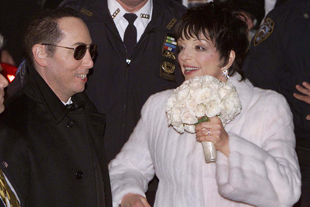 Liza Minnelli and new husband David Gest leave the Marble Collegiate Church in New York City, March 16, 2002 after their wedding. The wedding, which was attended by hundreds of celebrities, was the fourth for Minnelli. REUTERS/Mike Segar MS - RTR2MEZ