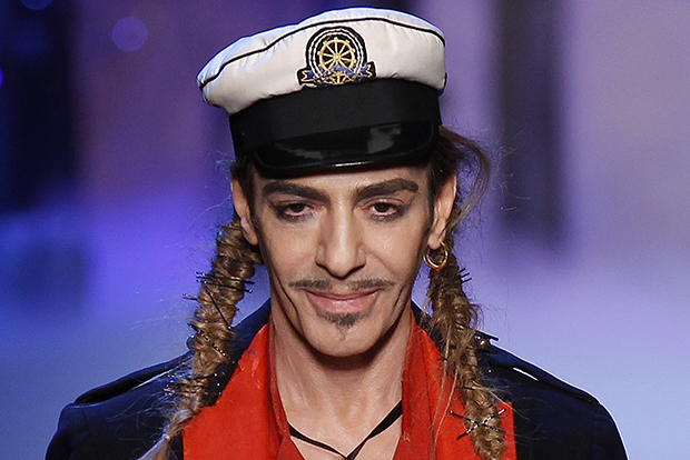 British designer John Galliano appears at the end of his Spring/Summer 2011 women's collection during Paris Fashion Week in this October 1, 2010 file photo. REUTERS/Benoit Tessier/Files (FRANCE - Tags: FASHION) - RTXZF8O