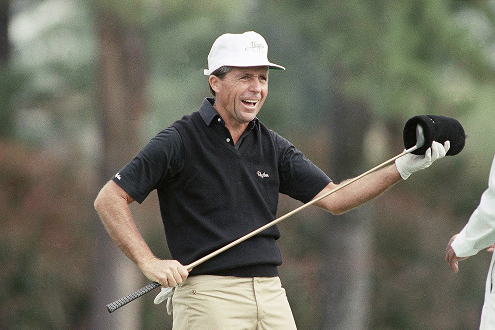 South African Gary Player, a three-time winner of the Masters, pull the cover from his club as he prepares for a practice round for the 1989 Masters at Augusta National Golf Club in Augusta, Tuesday, April 4, 1989. (AP Photo/Steve Helber)