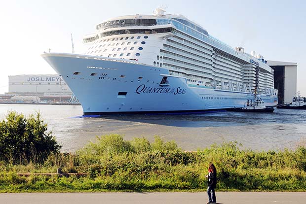 13 Aug 2014, Papenburg, Germany --- The new cruiser 'Quantum of the Seas' of Meyer Werft leaves the dry dock in Papenburg, Germany, 13 August 2014. The 'Quantum of the Seas' is the third biggest cruise ship of the world with a length of 348 meters. The high tech ship of US shipping company 'Royal Caribbean International' is expected to be put out to the North Sea in September. Photo: INGO WAGNER/dpa --- Image by  Ingo Wagner/dpa/Corbis